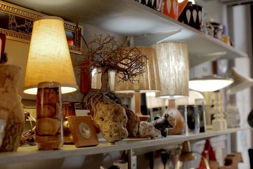 Shelves of assorted decor and table lamps for sale at Jarontiques 