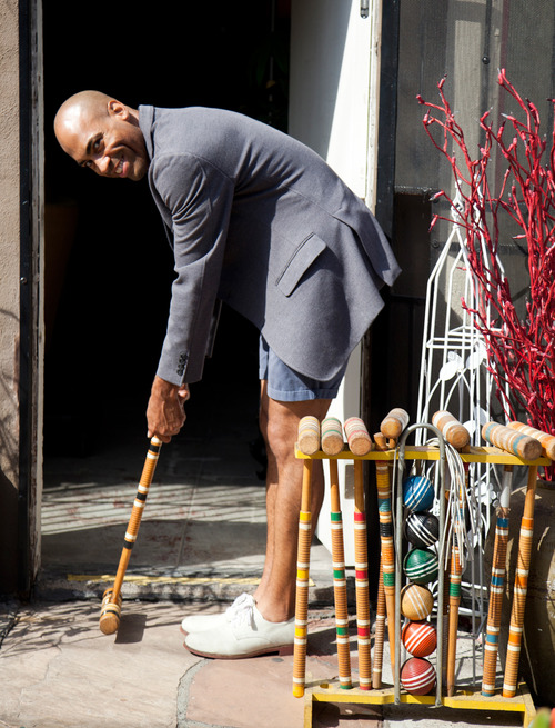 Shawn Meaux of Neo Vintage Decor poses with vintage croquet mallets 