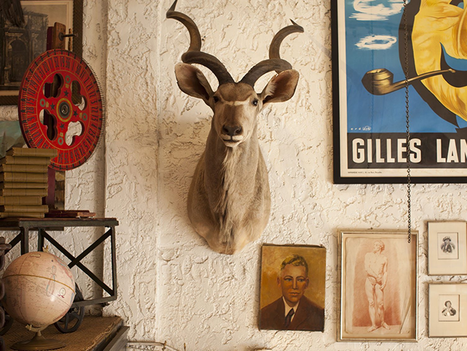 Gazelle head wall mount with Assorted Paintings and Rustic accessories  at Inheritance  