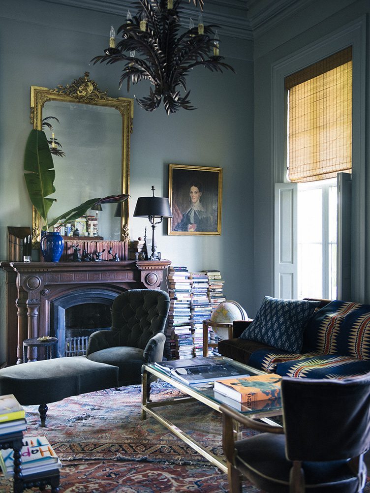 Traditional Living Room With Velvet Armchair and Ottoman and Natural Inspired Metal Chandelier