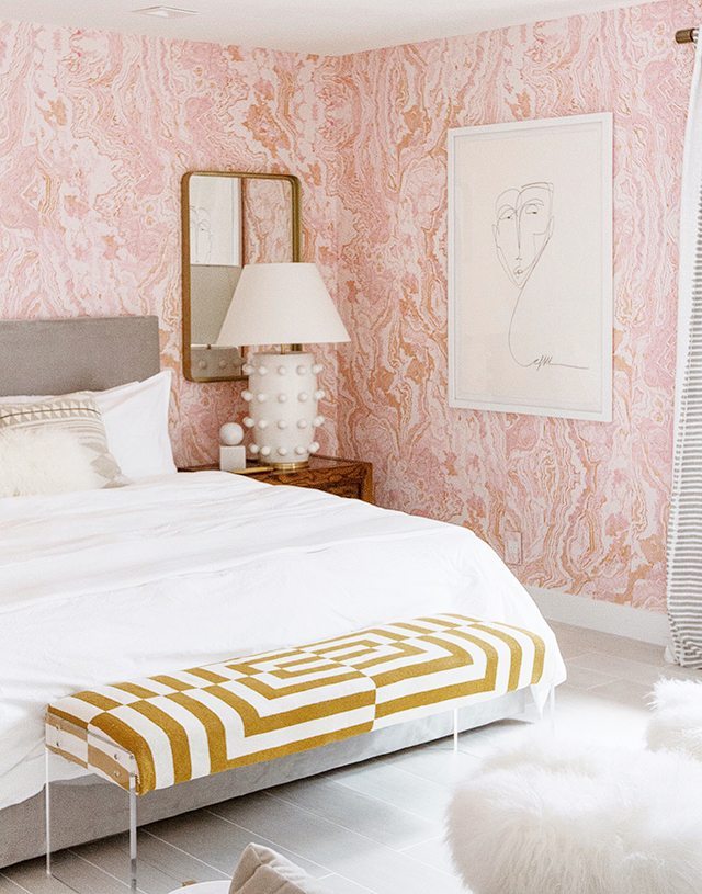 Contemporary bed, bedroom bench, and painting in pink bedroom