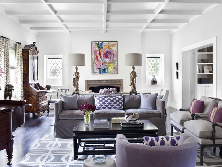 Classic modern sofa , twin gray armchairs, purple accent chairs, and modern lamps in living room