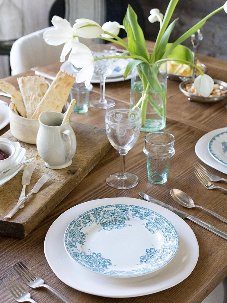 Table Setting with Blue Patterned Plate and Glassware on Chairish.