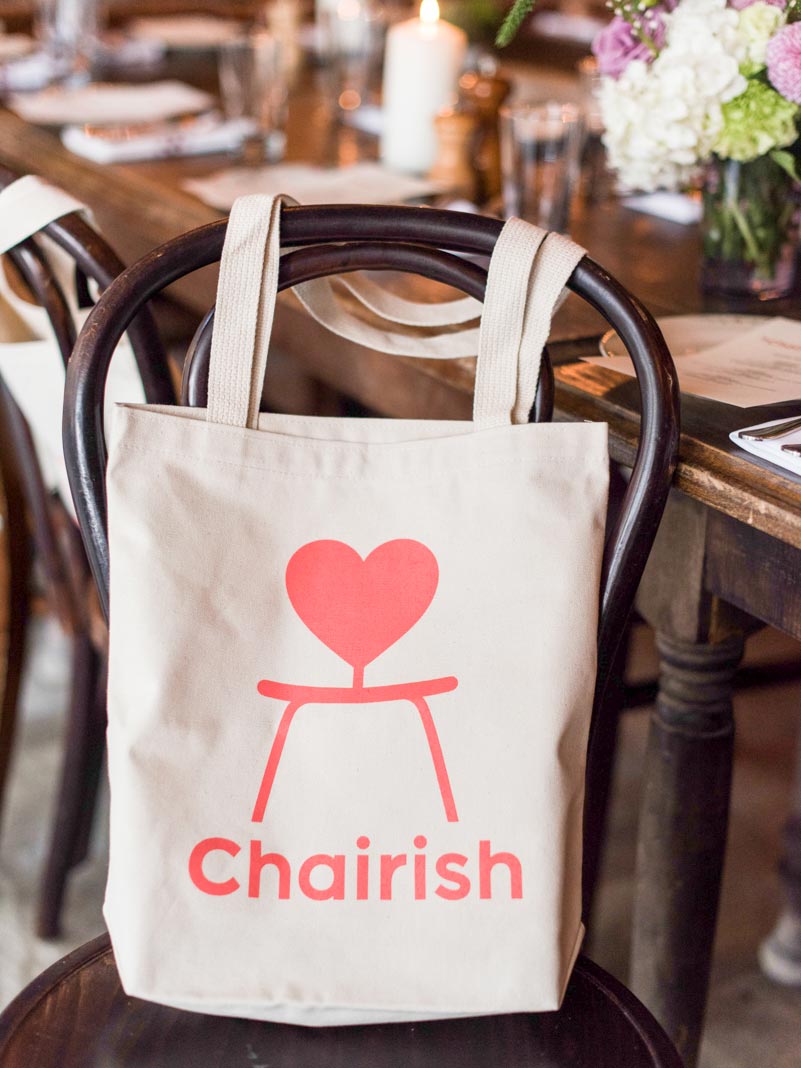 Chairish tote bag on a dark wood bistro-style chair at New York chairish dinner