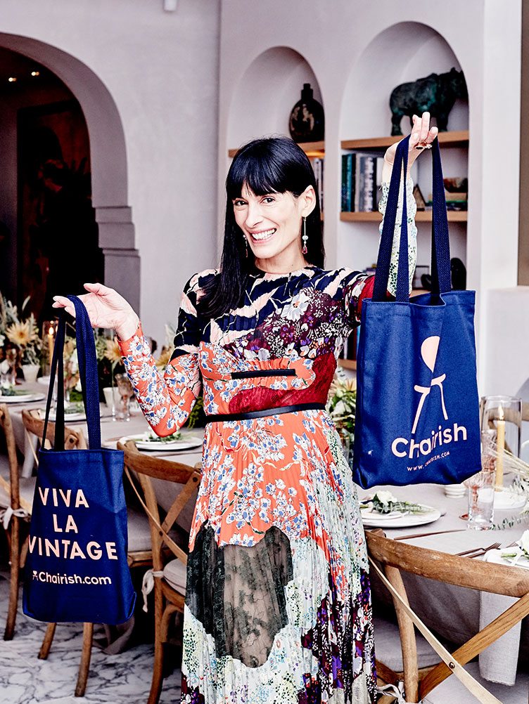 Athena Calderone with gift bags at her chairish dinner party.