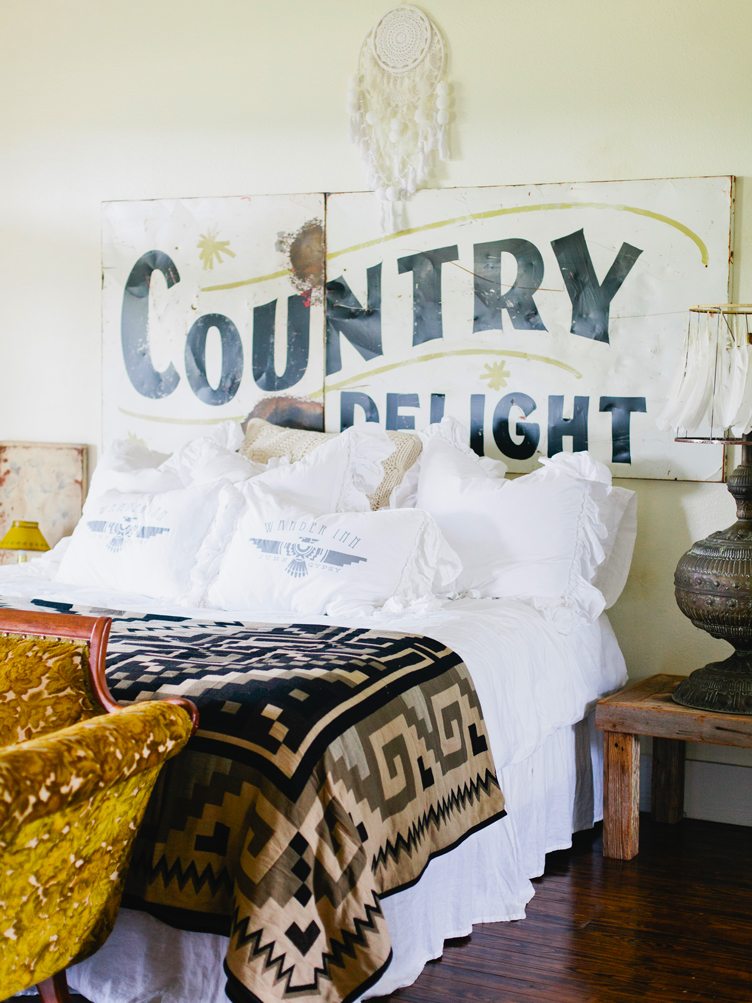 Bedroom with "Country Delight" headboard and white dreamcatcher 