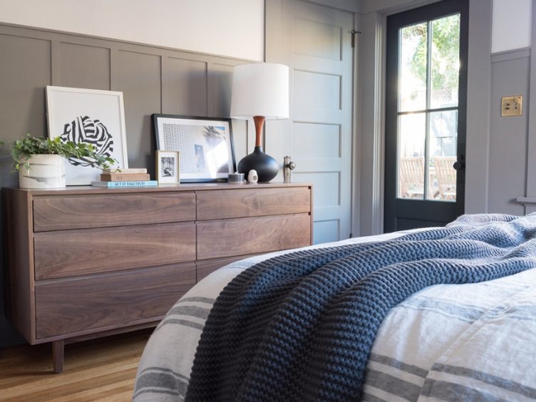 Master Bedroom with Wooden Dresser and Contemporary Print Artwork. 