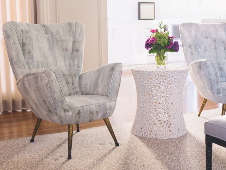 Mid Century Modern Armchair with a Mix of Shades of Grey and a Textured White Coffee Table on Chairish.