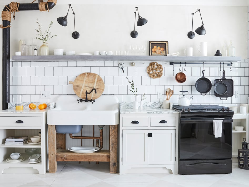 Rustic Kitchen with Eclectic Mix of Appliances and Minimalist Metal Light Fixtures.