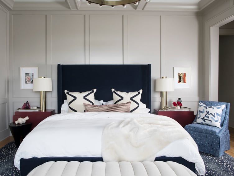 Angela Chrusciaki Blehm House with blue upholstered bed frame and white blankets