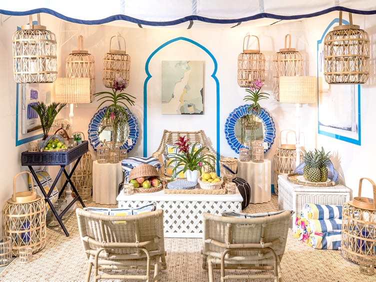 Sitting room with rattan furniture and lanterns and natural fiber rug