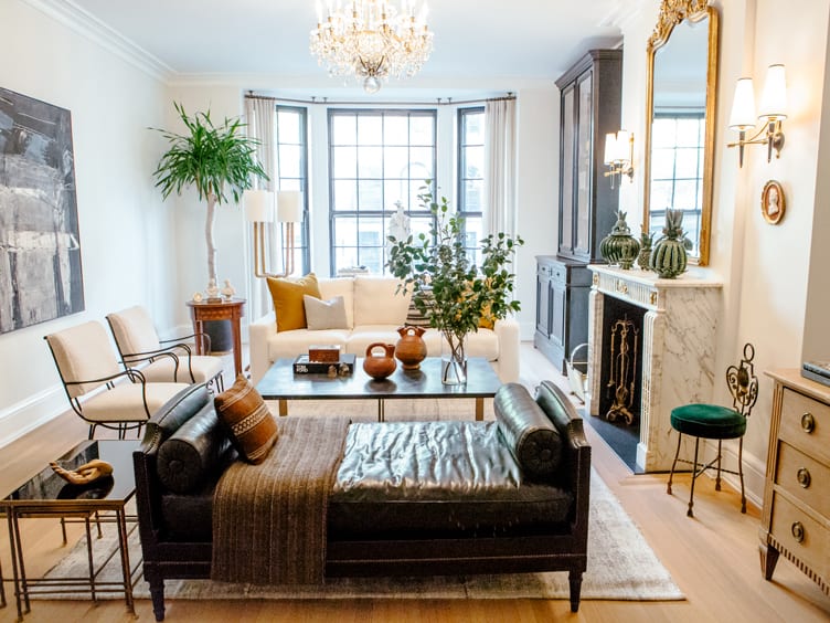 Traditional Living Room with Brown Leather Day Bed and Crystal Chandelier. 