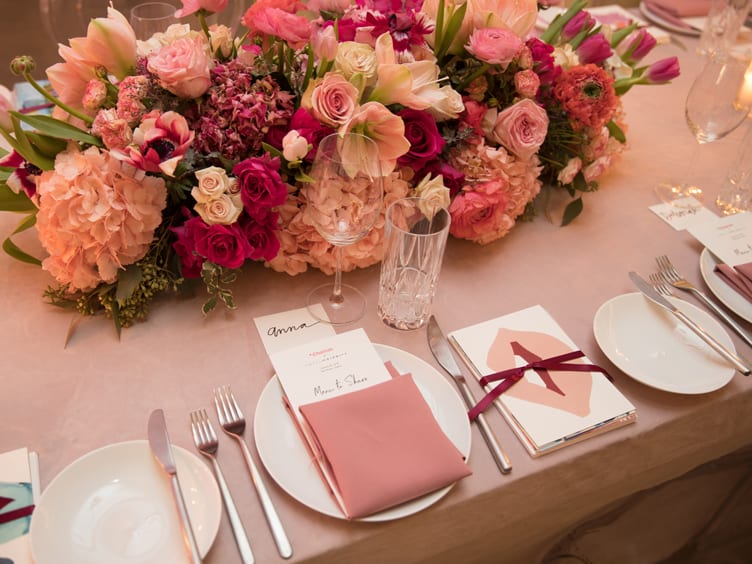 Pink and white place settings and floral centerpieces at the Park House 