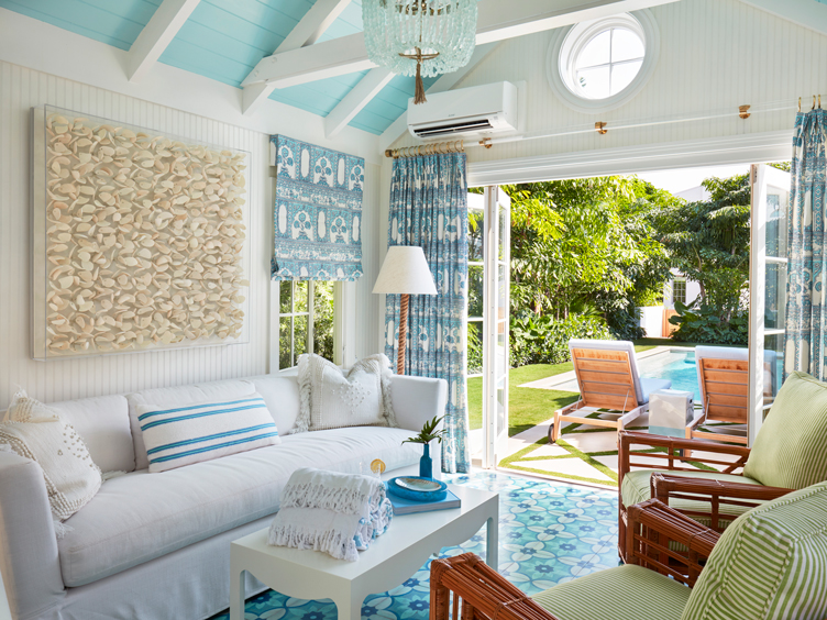 Pool room with white bead board and blue tile floor with seashell art