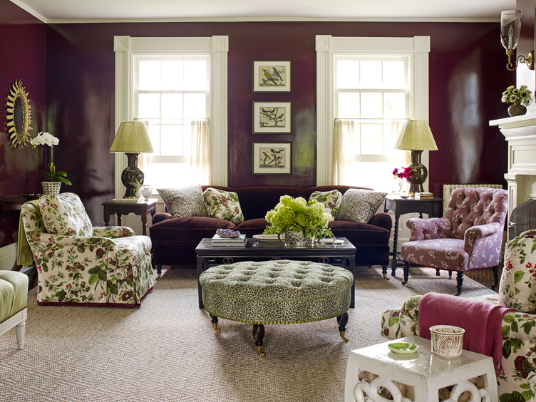 Traditional plum living room with floral armchairs and cheetah print ottoman