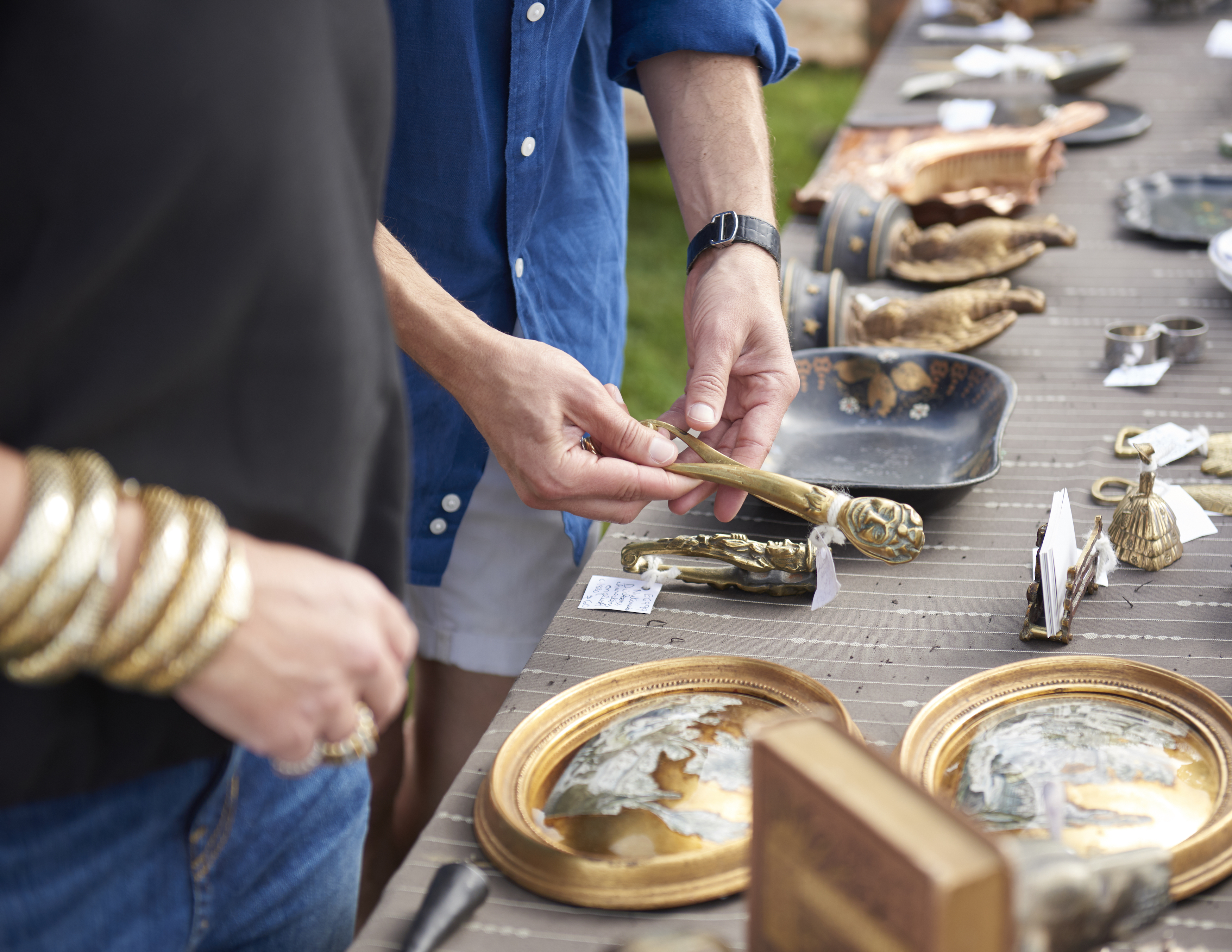 Vintage gold and brass art pieces for sale at top East Coast flea market.