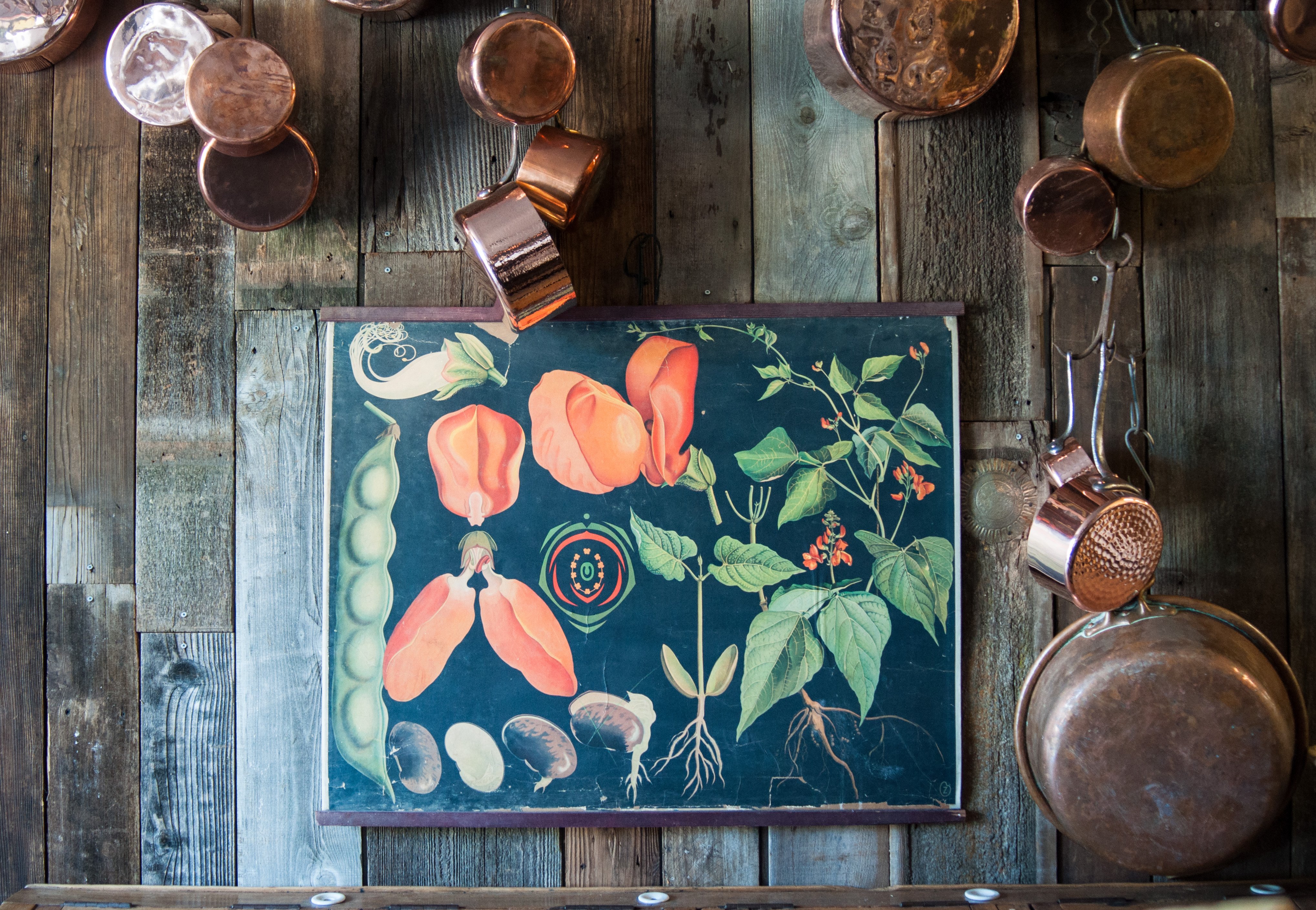 Art and copper cookware for sale at East Coast flea market.