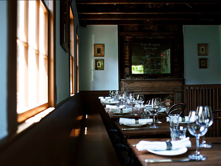 restaurant interior wine glasses fireplace gallery wall design insiders guide to charleston