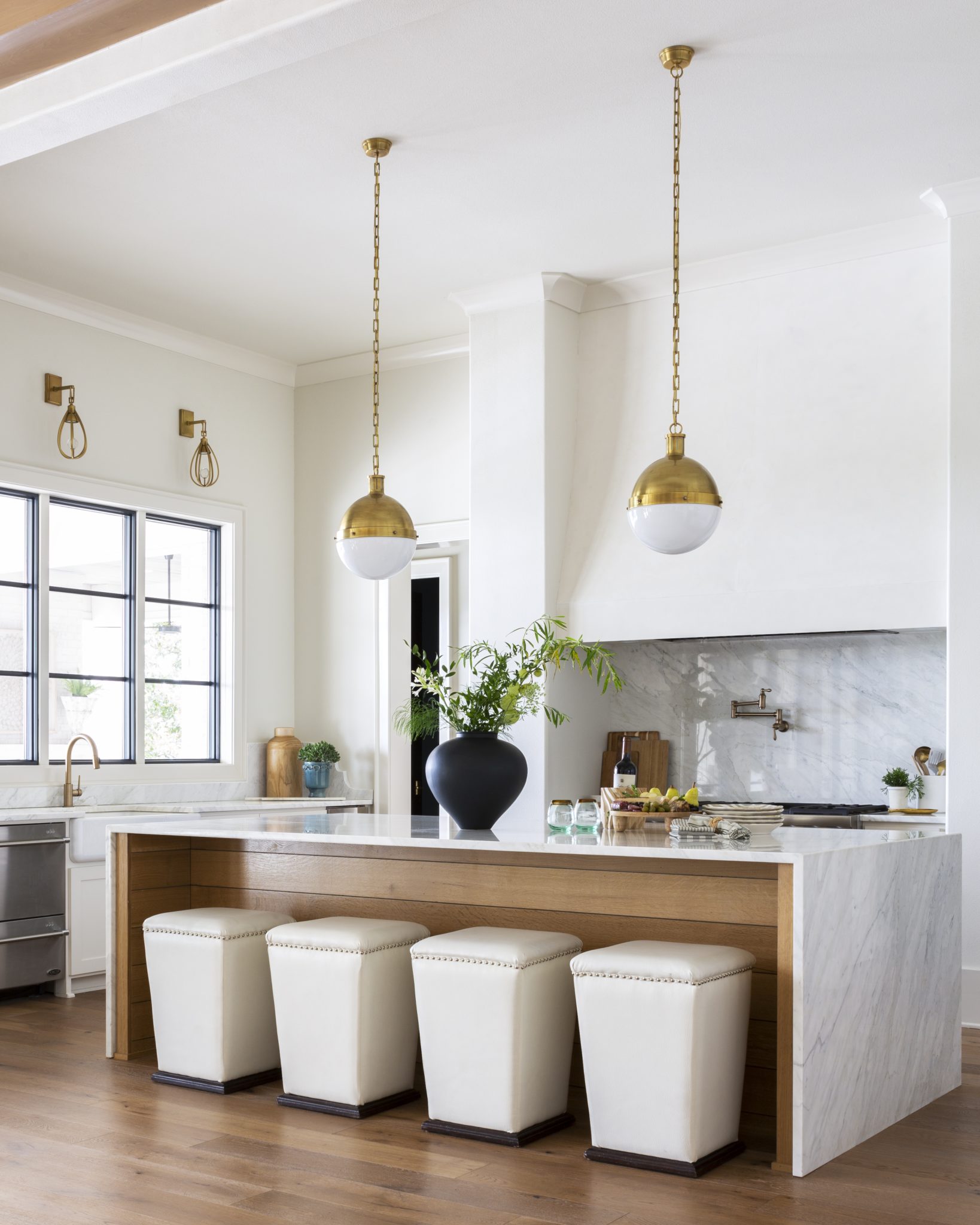 New Traditional Residence modern kitchen featuring a quarter sawn whiteoak island, venetian plaster venthood and marble waterfall counters. by Casey Sarkin Interior Design, Luna Inc.