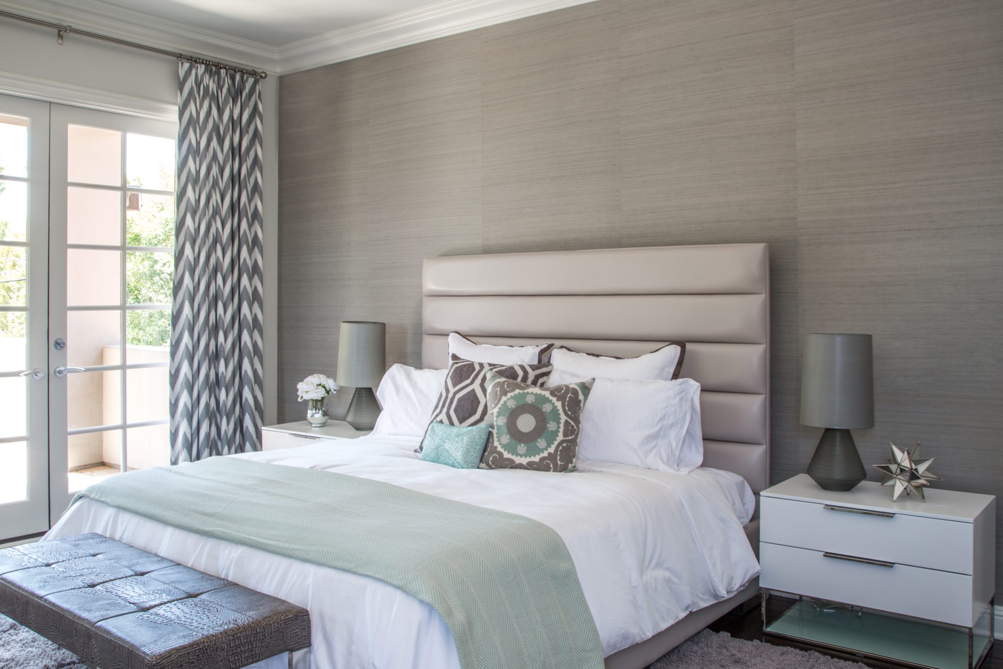 Taupe master bedroom featuring grass cloth wall covering by dmar Interiors