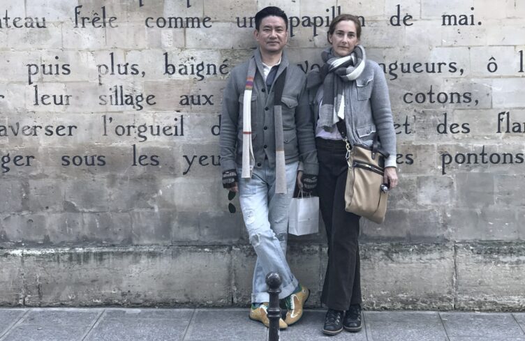 Bo Jia and Alison Alten of Middle Kingdom and Cobalt Guild pose in front of stone wall