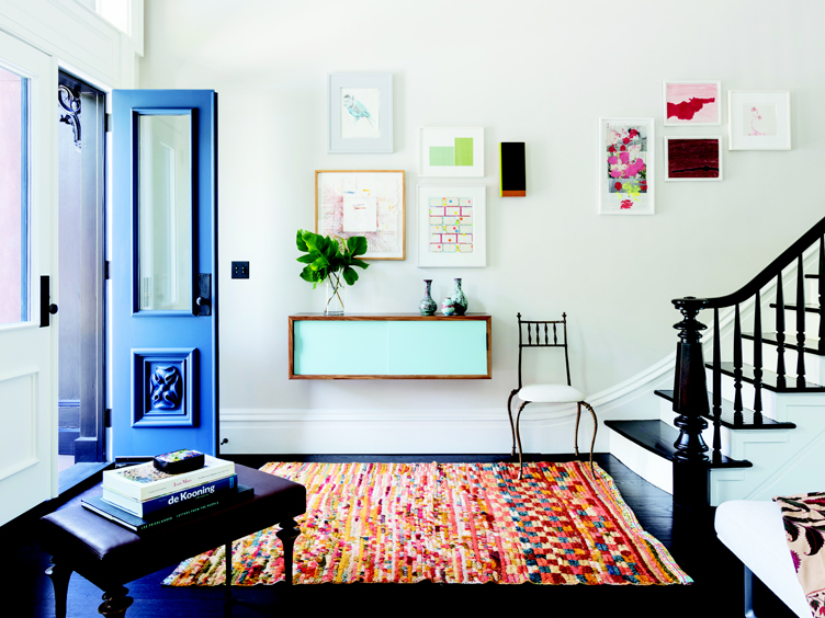 Brooklyn Townhouse - Entry/Hallway with blue door, colorful Moroccan rug, and teal hanging wall console