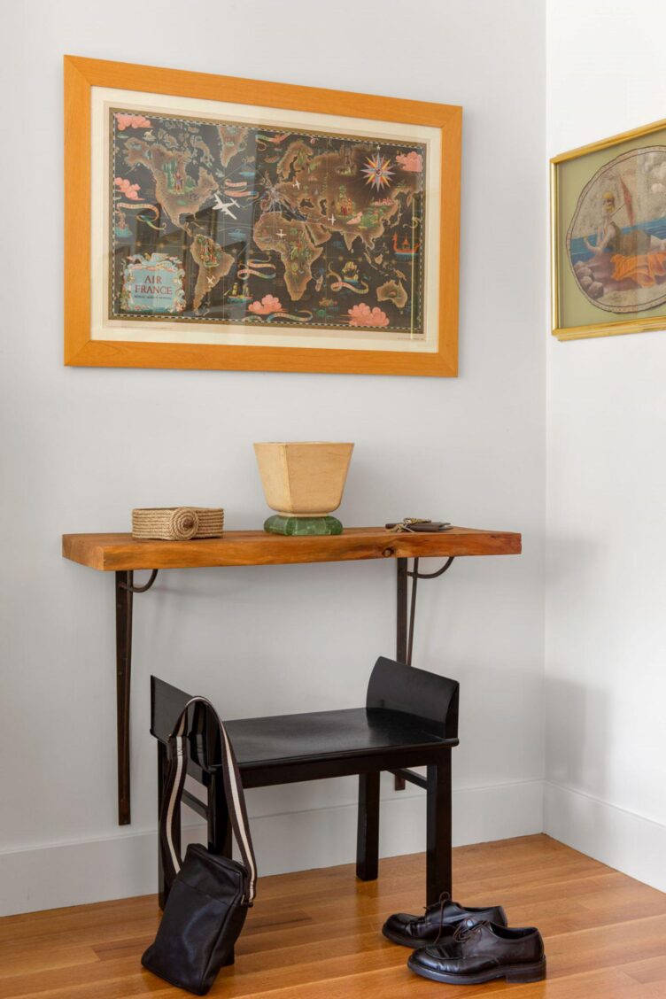 Small Art Deco pied a terre with an antique bench and wall console